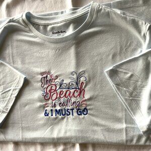 Women Light Blue Tshirt Embroidery on front "The beach is calling me I must go"